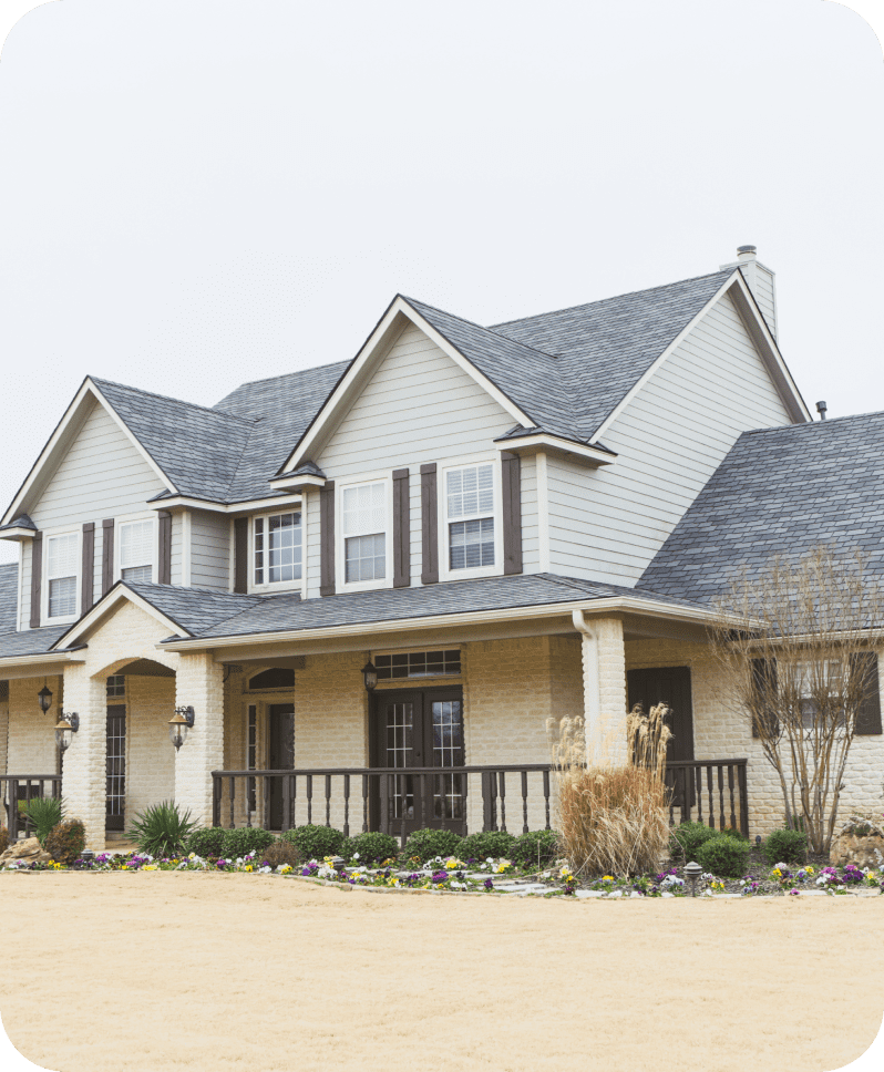 Two-story suburban house with front garden.